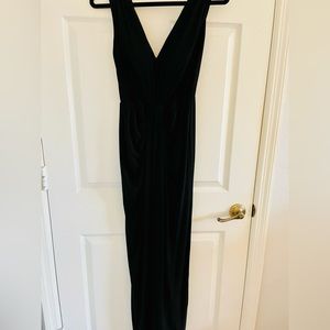 White House Black Market. Full length black dress with slit in back. Size 2